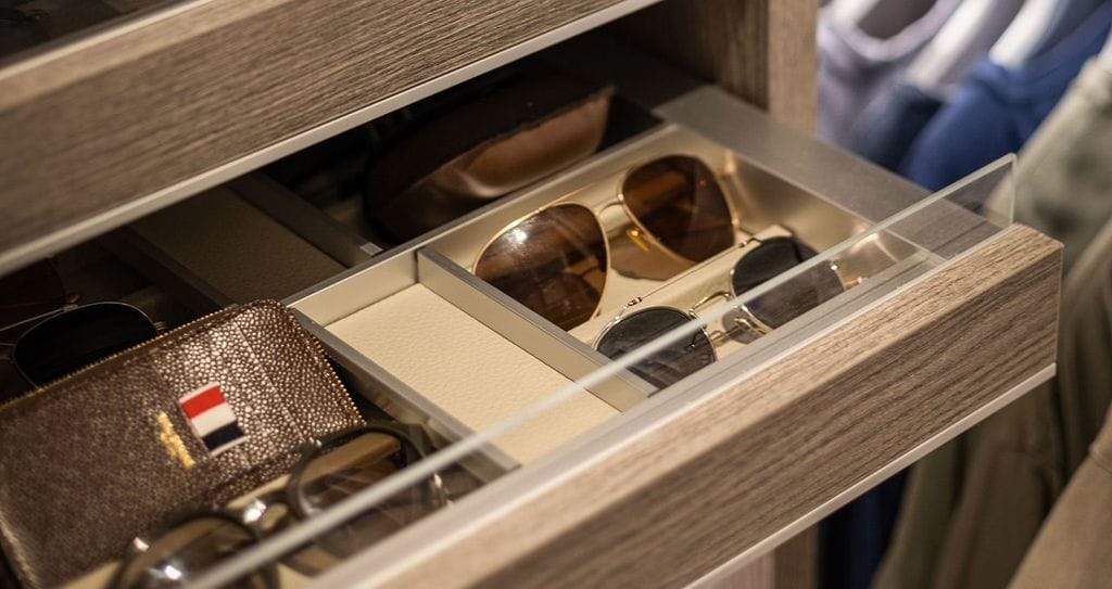 Antoni Porowski’s custom closet accessories drawers in a wood grain finish by California Closets
