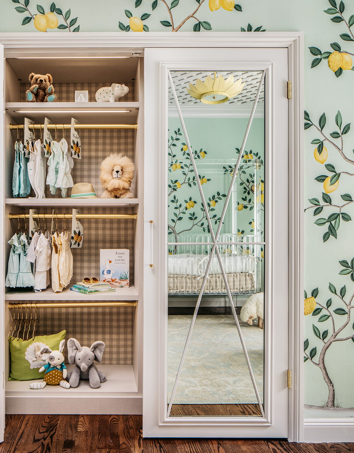 Mirrored closet doors for kids' bedrooom opened to show shelving inside created by California Closets