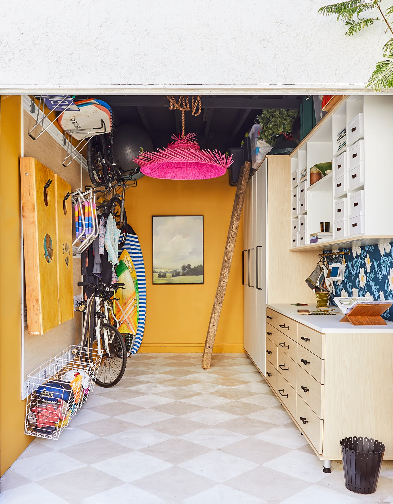 Custom garage storage with shelving system, large custom cabinets and storage rack by California Closets