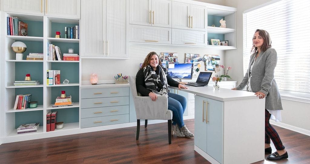 Large home office design with full wall storage cabinets and shelves in white finish by California Closets