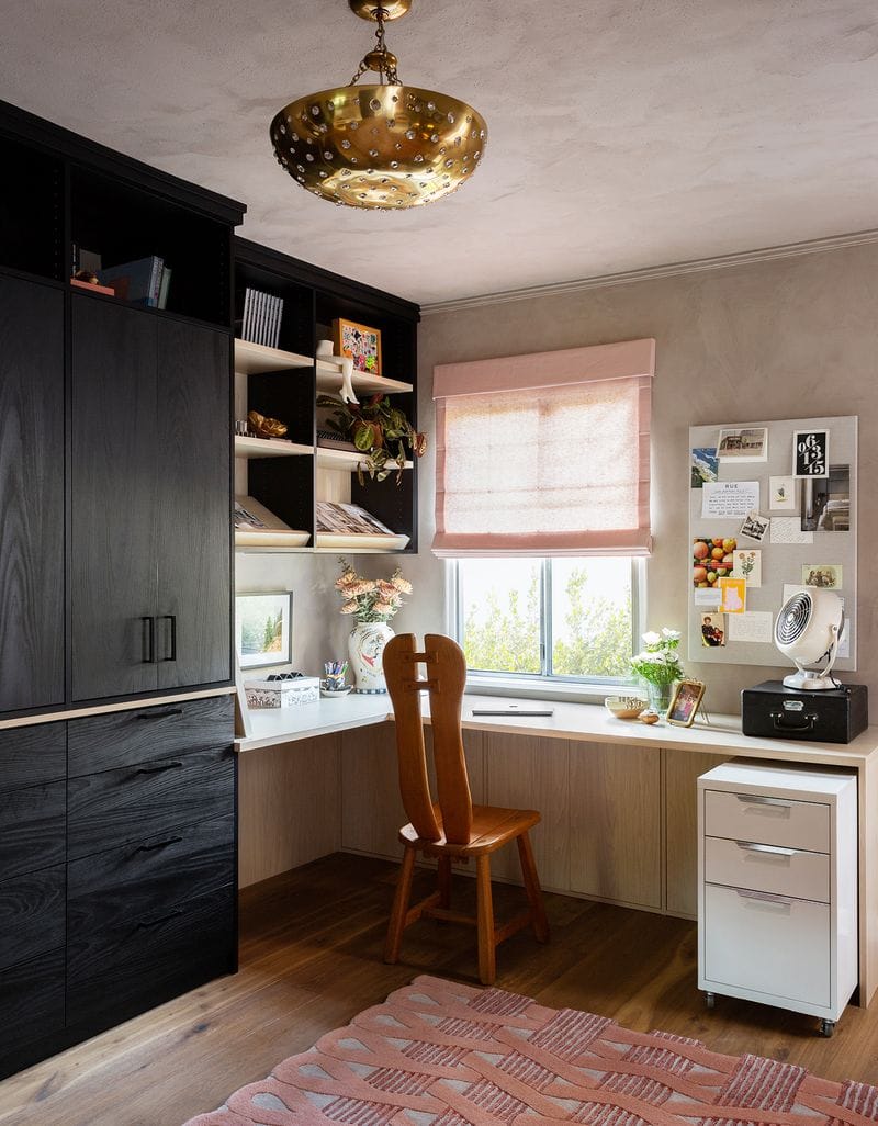 Home office and closet combine to maximize a small space designed in light and dark wood grain finishes by California Closets