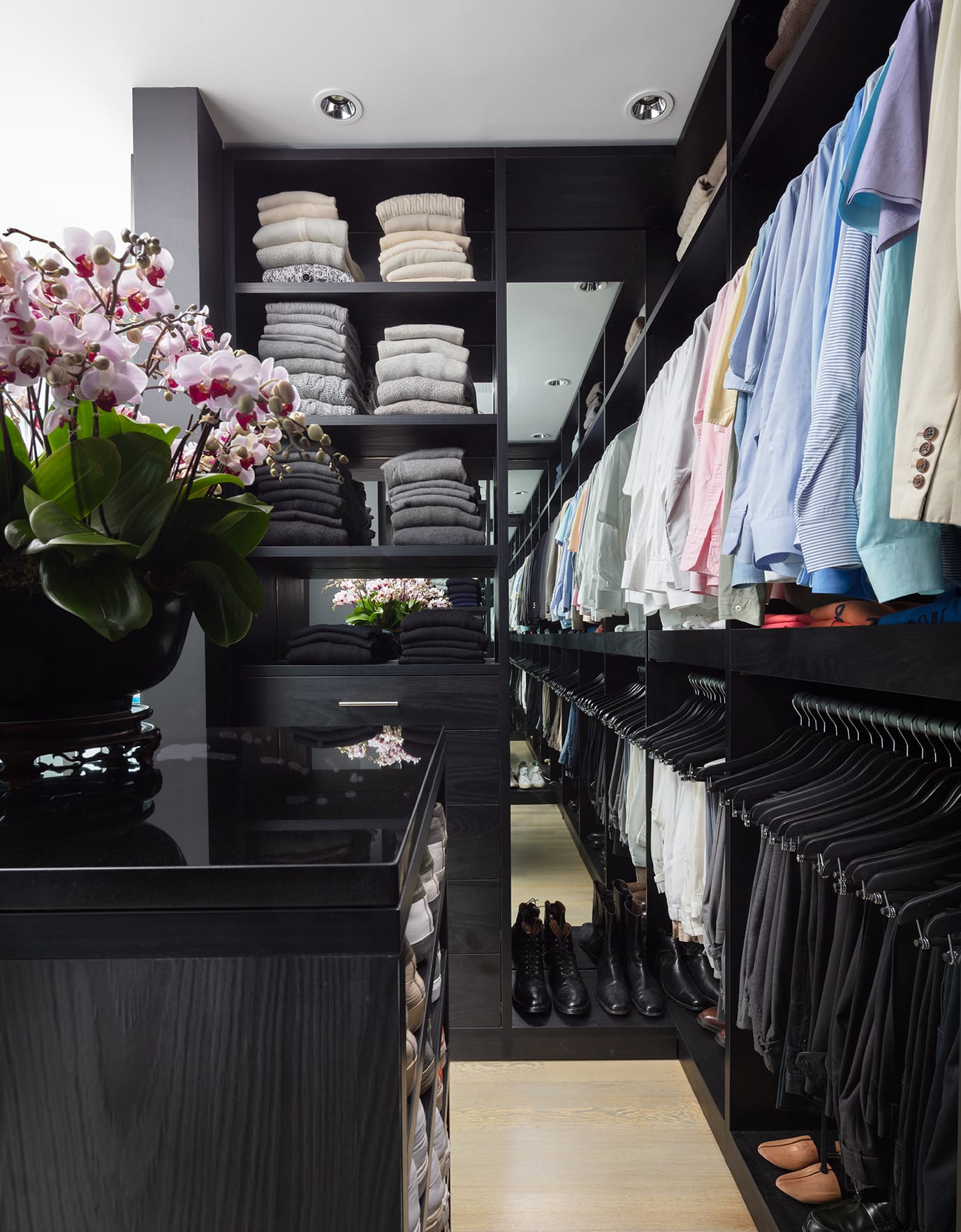 Custom closet system created for Kevin Sharkey with built in island and shoe storage by California Closets