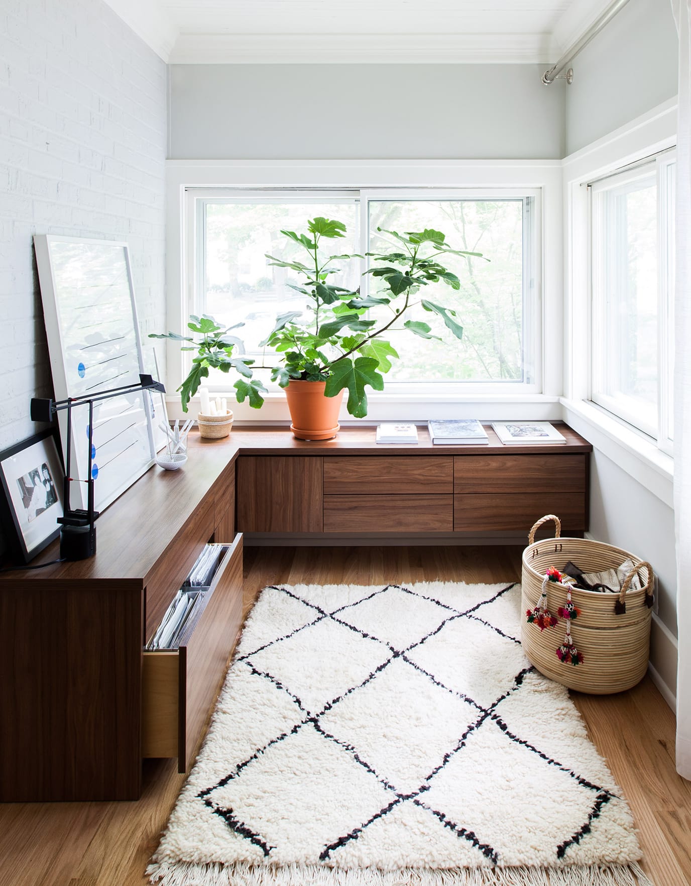 Home office custom floating cabinet storage designed in ddark wood finish by California Closets