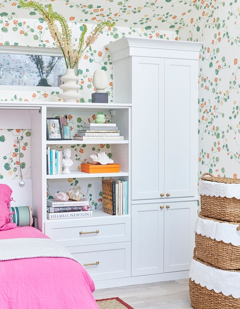 Murphy wall bed opened with built in shelving storage and custom cabinets by California Closets