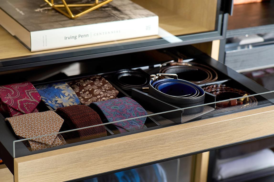 Custom built closet drawer for ties and belts custom designed by California Closets