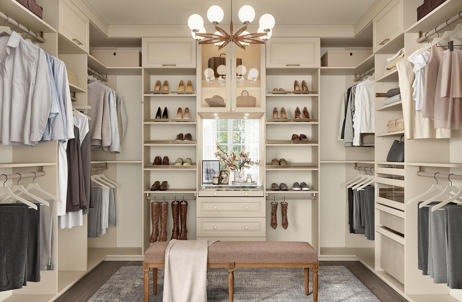 Luxury custom closet designed in walk-in layout with built in dressers, hampers, shelving, shoe storage and glass cabinets by California Closets