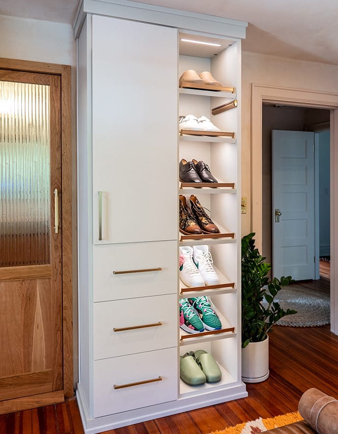 Hilton Carter steps up his shoe storage with LED lighted shoe shelves and open space from California Closets