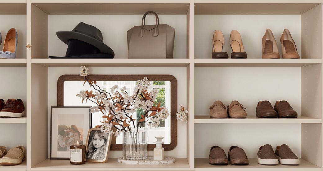 Shoe storage cubbies and space for purses, jewelry and flowers in custom closet from California Closets