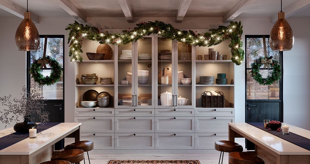 Farmhouse pantry home for holidays decorated with lighted garland and wreaths from California Closets
