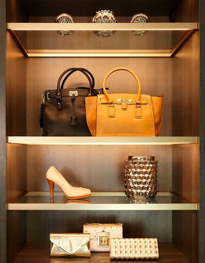 Open closet shelving hor shoes, handbags and other accessories designed by California Closets