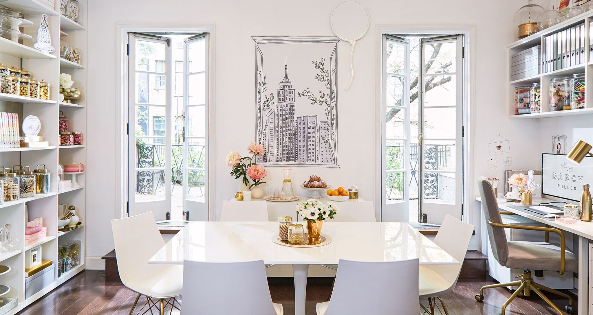 Darcy Miller's custom creative studio and office with shelving, desk and drawers by California Closets