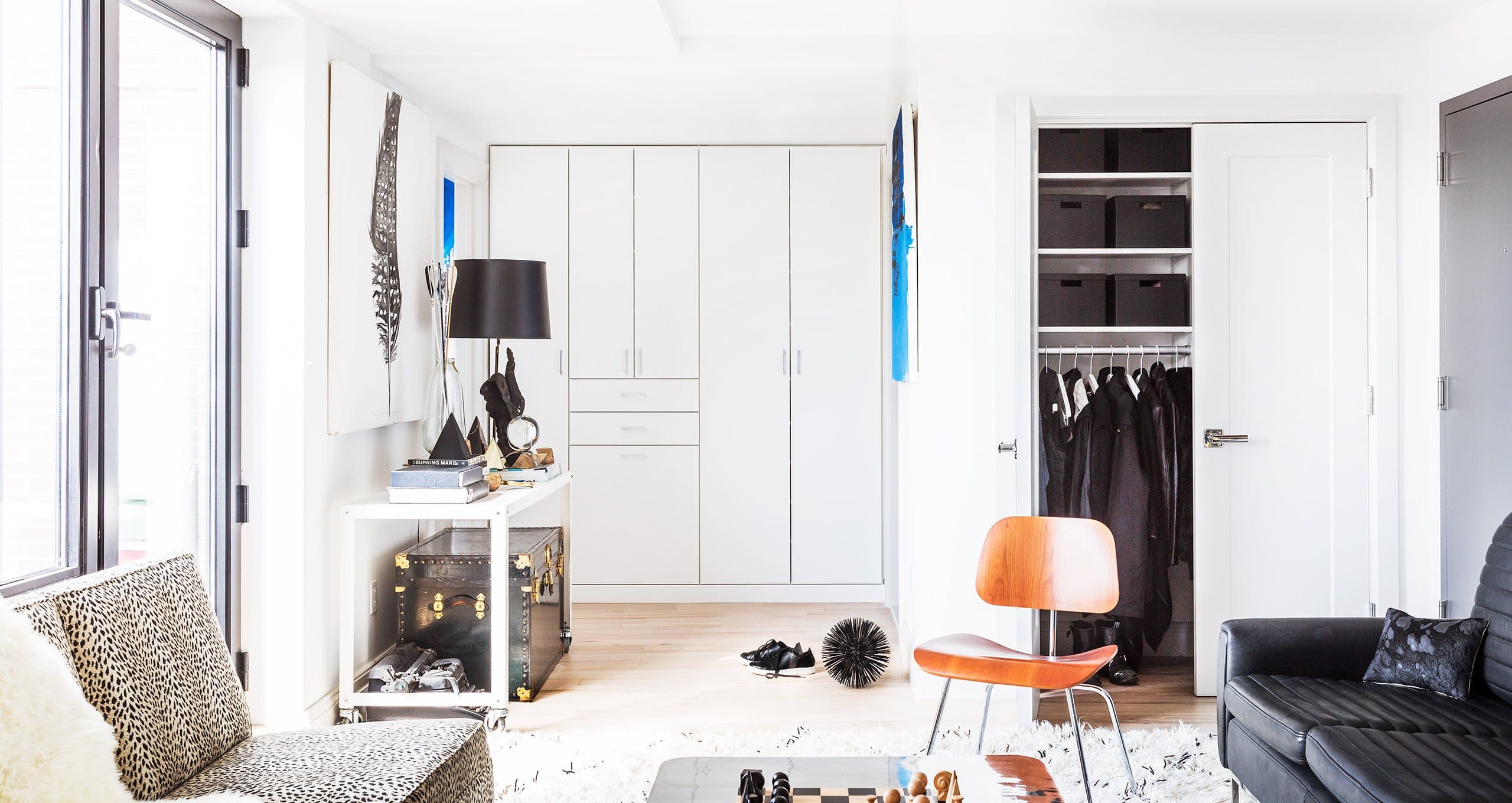 Erin Swift's open sitting and dressing room with custom reach in closet by California Closets