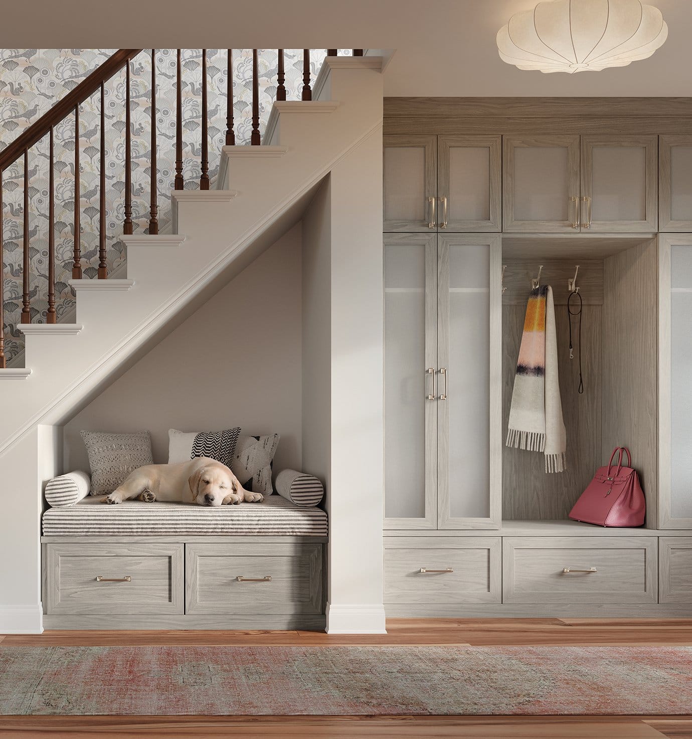 Storage for entryway with custom built in cabinets and place for a dog to rest in light grey finish by California Closets