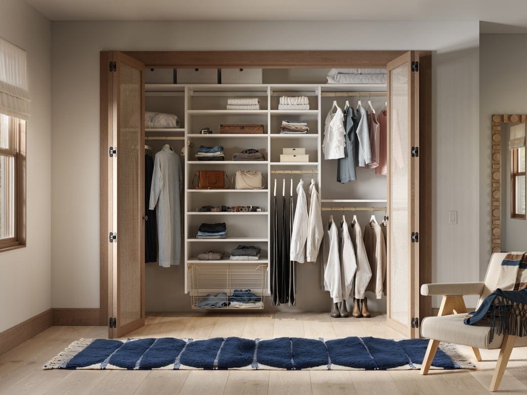Personalized reach in closet, with open shelving, customized shelf design, long and short hanging wardrobe bars and closet organizers by California Closets