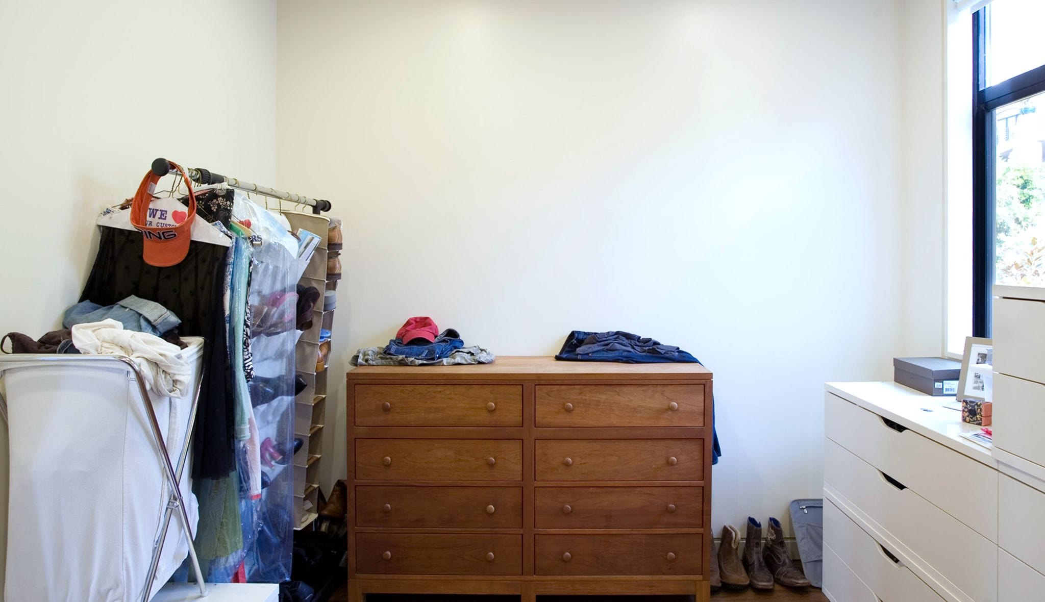 Customer before image of room without organization. California Closets will design and install.