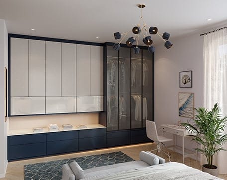 Wardrobe closets designed in dark and light finishes with custom cabinets and drawers by California Closets