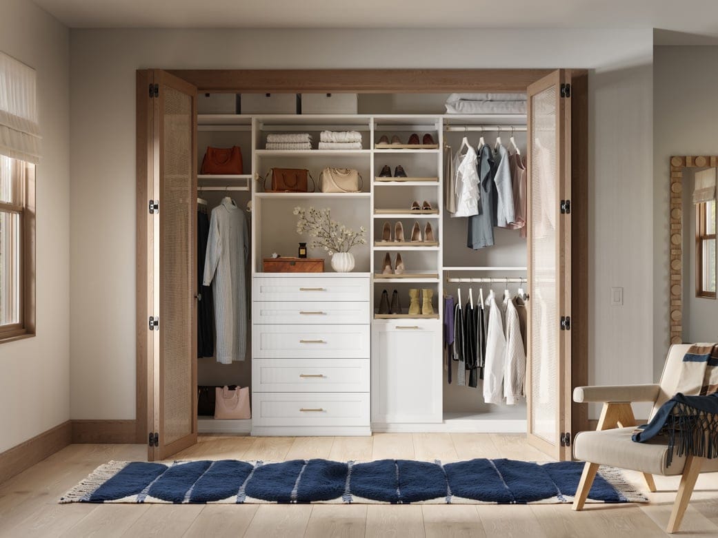 Custom closet system reach in design with shoe storage and custom drawers by California Closets